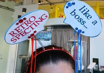 Headband with speech bubbles: "RETRO SPECTING" and "like a boss...